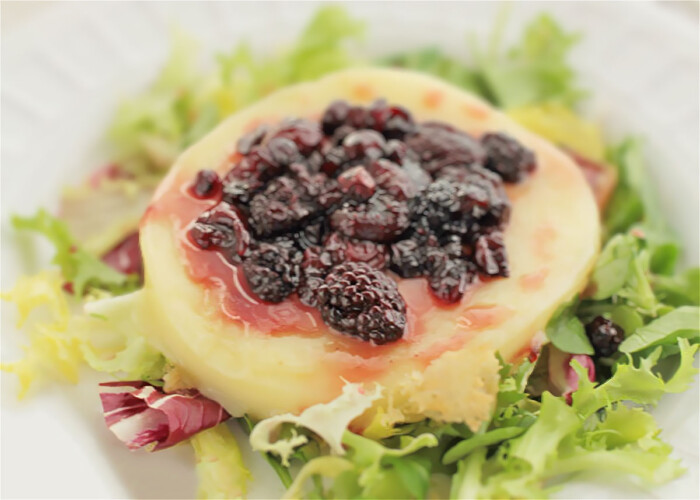 Grilled provolone cheese with red berries